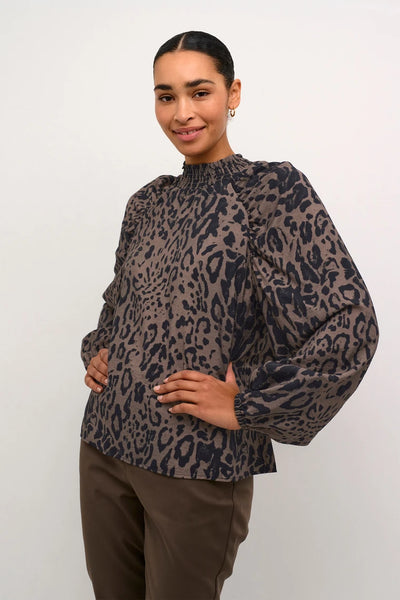 Unleash your wild side with the Kaffe Jemma Blouse in Major Brown! This leopard print blouse is the perfect addition to your fall wardrobe. Layer it up or style it on its own - either way, you'll be turning heads with this versatile and stylish piece.    Made of 87% viscose, 13% nylon, machine wash 30 and air dry where possible&nbsp;