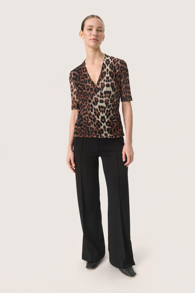 Soaked In Luxury - Aldora Leopard Wrap Blouse shown on a model