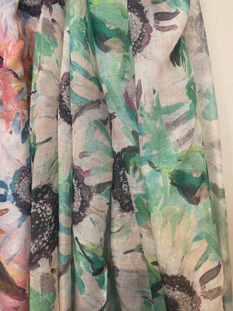 Unleash the beauty of summer with the Vivadi - Pastel Watercolour Sunflower Scarf! Lightweight and soft, this scarf features a mix of pastel watercoloured flowers in blue, pink, or green. Elevate any casual outfit with a touch of colorful elegance. Perfect for those who want to look effortlessly stylish!    Made of 100% polyester, machine wash 30 and low iron if needed&nbsp;