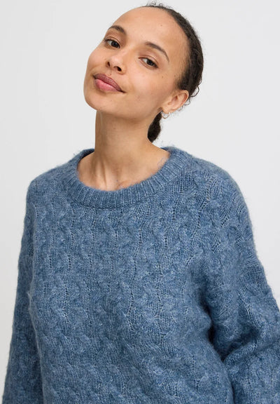 Stay cosy and stylish this autumn with our B Young - Omhu Jumper! This gorgeous light dusty blue cable knit jumper is perfect for any occasion. Whether you're lounging at home or heading out for a day of adventure, this crew neck jumper will keep you warm and looking fabulous.



Made of &nbsp;52% polyester, 22% acrylic, 22% nylon, 4% alpaca wool, Machine wash 30 and reshape while wet