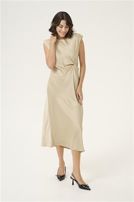 pristina dress on  model showing calf length and twist detail at waist. Attractive cap sleeves with slight padded shoulder