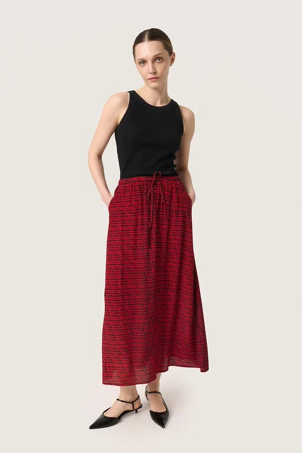 Soaked in Luxury - Alize Silky Patterned Skirt IN RED ON A MODEL