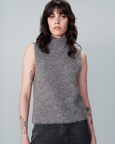 Stay cosy and stylish all year round with Grace &amp; Mila's Naima Knit Wooly Gilet Top. This fuzzy and warm vest is perfect for layering, making it a must-have for your wardrobe from autumn to spring. Available in Gris or Ecru.    Made of 52% recycled polyester, 32% nylon, 10% wool, 6% alpaca, Machine wash 30 and reshape while wet if needed&nbsp;